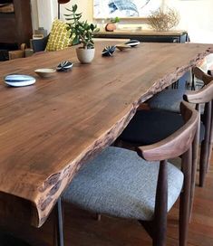 a large wooden table with chairs around it