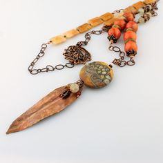 "A lovely combination of agate and quartz gemstones, antique copper chain, handmade copper components and clasp, and accented with my handmade lampwork glass beads, wire wrapped with a hand formed folded copper leaf, made by moi, and little gemstones. This super long, one of a kind lampwork necklace measures 33\" with a 5\" pendant and will arrive beautifully packaged. Sure to garner lots of compliments! To view more jewelry and handmade beads, click here... https://www.etsy.com/shop/StoneDesign Artisan Wire Wrapped Necklace For Jewelry Making, Artisan Copper Beaded Necklaces For Jewelry Making, Bohemian Wire Wrapped Beaded Necklaces With Czech Glass, Bohemian Copper Necklace With Beaded Chain, Bohemian Beaded Chain Copper Necklaces, Bohemian Czech Glass Beaded Necklace With Wire Wrap, Bohemian Copper Beaded Chain Necklaces, Bohemian Wire Wrapped Czech Glass Beaded Necklace, Bohemian Copper Dangle Necklaces