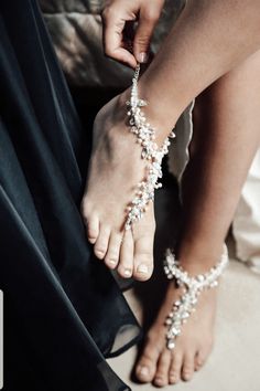 Bridal foot jewelry sandals inspired by natural shapes and movement. A glistening leafy vine encircles the ankle in the most elegant of ways and if you want to buy then visit Nelipots. Elegant Beaded Wedding Sandals, Elegant Silver Toe Ring Barefoot Sandals, Elegant Silver Beaded Barefoot Sandals, Elegant Embellished Summer Jewelry, Elegant Beaded Barefoot Sandals For Wedding, Elegant Toe Ring Barefoot Sandals For Party, Elegant Beaded Anklets With Ankle Strap, Elegant Beaded Anklets For Wedding, Elegant Pearl Anklets For Party