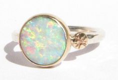 Opal Ring - Silver & 14k Gold Ring - Stackable - Statement Ring - Opal Gold Ring - 14k Gold Opal - Opal Engagement Ring - Gold Opal Ring - MADE TO ORDER. This ring comes with a silver band, but the bezel can be either in 14k solid YELLOW or ROSE gold (whatever you prefer). White Opal ( 10 mm across ) set in 14k solid rose, or yellow gold, with a small engraved 14k gold disc on one side, on top of a round, hammered sterling silver band (2 mm wide). Shiny finish. MADE TO ORDER in your size! The ba Opal Gold Ring, 14k Gold Opal Ring, Gold Opal Ring, Oval Halo Engagement Ring, White Opal Ring, Rose Gold Morganite, Gold Rings Stackable, Opal Engagement Ring, Opal Ring Gold