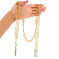 This extra long Italian Made Mesh Scarf necklace is crafted in solid 18k yellow gold with 18k white gold borders. This wrap around bead necklace is 41 inches long and 20 mm wide with 18k white gold tassel at the end. Weight : 107.2 Grams In stock in excellent condition. Luxury Gold Long Necklace, Gold Beaded Chain Jewelry For Evening, Gold Jewelry With Beaded Chain For Evening, Luxury Gold Long Chain Necklace, Elegant Multi-strand Chain Necklace With Gold Beads, Luxury Lariat Chain Necklace For Evening, Elegant Yellow Multi-strand Necklace, Elegant Yellow Gold Chain Necklace With Gold Beads, Elegant Silver Lariat Necklace With Gold Chain