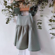 Sage green baby dress, cotton muslin with boho style ruffle diaper cover, a perfect outfit for spring. It is the cutest, the perfect gift for toddlers and newborns. Ideal garments for fun moms or to make a very special gift. You will find many assorted items in the store, it's up to you to compose your own sets! https://www.etsy.com/listing/1560447171/muslin-baby-dress-with-long-sleeves-in?click_key=39c1d339605cb5aedbac38b610c6fdbec4f31bce%3A1560447171&click_sum=3cfebd6f&ref=shop_home_active_1&f Cute Flowy Ruffle Dress For Summer, Spring Cotton Sundress For Playdates, Cute Ruffle Dress For Summer Beach, Cute Ruffle Dress For Beach In Summer, Cute Summer Ruffle Dress For The Beach, Cute Ruffle Beach Dress For Summer, Cute Summer Beach Ruffle Dress, Cotton Sundress For Babies For Beach, Spring Ruffle Dress For Playdate