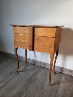 an old wooden desk with two drawers on one side and a drawer on the other