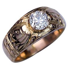 Circa 1890 This highly unusual antique 14K gold ring is chased with two profile busts of an Egyptian pharaoh and stylized floral designs. The ring is prong set with a sparkling old European cut diamond (J color, SI2 clarity, 6.4-6.3 x 4.3 mm, approximately 1.10 ct). Width 10 mm (3/8 in.) Weight 8.75 grams Rinz size 9.5 (20 mm) Engagement Ring Men, Antique Mens Rings, Vintage Solitaire Engagement Ring, Rings Mens, Stunning Diamond Rings, S Ring, Solitaire Rings, Mens Rings, Mens Gold Jewelry