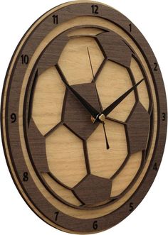 a wooden clock with an image of a soccer ball in the center and numbers on each side