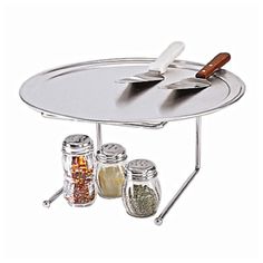 a silver tray with spices and spoons on it