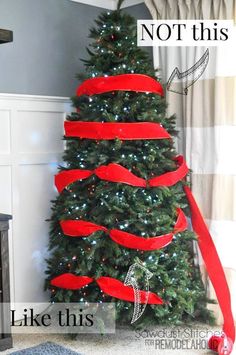 a decorated christmas tree with red ribbon on it and the words, not this like this