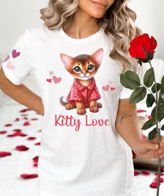 Embrace sweet dreams with our cute Abyssinian Kitty Love oversized nightshirt, a perfect present for  Valentine's Day, anniversaries, or birthdays. Give to your best friend, girlfriend, mom, wife, sister, or grandma who adores cats. Available in sizes 2XS - 6XL, this soft nightgown is incredibly comfortable and beautifully designed with a cute Abyssinian kitten in red heart pajamas on the front and pink hearts printed on the sleeves and back. Whether you're a cat owner yourself or want to pamper someone special, this nightgown is the ultimate choice. Our nightshirt features an oversized fit, stretchy fabric, and a drop shoulder for extra comfort. 96% polyester, 4% spandex Medium-weight fabric Smooth and stretchy fabric Oversized fit Lowered armhole with a widened sleeve and a drop shoulder Pink Valentine's Day Sleepwear, Heart Pajamas, Valentine's Day Gift Necklace With Cat Design, Cute Nightgowns, Abyssinian Kittens, Pink Long Sleeve Sleepwear With Heart Print, Valentine's Day Heart Print Sleepwear, Babies Fashion, Cute Pink T-shirt With Cat Print