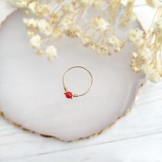 ❤ Tiny Red Coral Ring ❤14K Gold Filled, Rose Gold Filled, Sterling Silver Wire Wrapped Red Coral Ring, Pinky Ring❤ Red coral is the best stone to wear for vitality, energy & ambition. Its bright red color symbolizes blood and planet Mars which can be very powerful & energizing. It is believed to be effective in both prosperity & romantic love ❤ Sizing:• Gemstone Size: 4 mm• Ring Band: 0.8 mm• Handmade in your ring size with a natural gemstone bead and your choice of 14k gold-filled, rose gold-fi Dainty Red Birthstone Jewelry, Red Dainty Birthstone Jewelry, Adjustable Red Gemstone Birthstone Ring, Adjustable Red Birthstone Ring As A Gift, Red Hoop Jewelry For Everyday, Red Minimalist Jewelry With Birthstone, Red Round Ring For Everyday, Everyday Red Hoop Jewelry, Minimalist Red Birthstone Jewelry