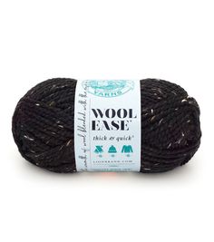 wool ease thick & quick yarn ball in dark brown, with white and black stripes