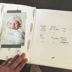 an open book with a baby's birth photo