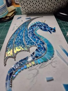 a blue dragon is sitting on the table