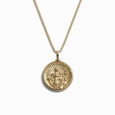 The Fortuna Necklace by Awe Inspired is a gold necklace showcasing a round pendant with an engraved design that symbolizes the Goddess of prosperity. Yellow Gold Necklaces With Coin Pendant For Blessing, Yellow Gold Round Necklace For Blessing, Spiritual Yellow Gold Coin Necklace With Round Shape, Classic Yellow Gold Necklaces For Good Luck, Good Luck Necklace With Large Round Pendant, Spiritual Yellow Gold Coin Necklace, Symbolic Good Luck Coin Pendant Necklace, Good Fortune Necklace, Luxury Good Luck Pendant Necklace