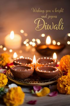 some lit candles are on a plate with flowers and candles in the background that says wishing you a bright and joyous diwali