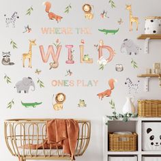 a baby's room with wall decals that say where the wild ones play