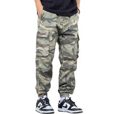 Unleash your inner adventurer with our Casual Straight-Leg Loose Camouflage Cargo Pants. Made with comfort and style in mind, these pants are perfect for any casual occasion. The straight-leg design offers a timeless look, while the loose fit allows for freedom of movement. With a trendy camouflage print, these pants are a must-have for any fashion-forward individual. Features: -100% Cotton -Mid-rise waist -Solid Color -Multi-Pockets -Regular Fit -Classic style Casual Camouflage Cotton Cargo Pants, Camouflage Cotton Joggers With Pockets, Baggy Military Cargo Pants For Outdoor Activities, Casual Camouflage Cargo Pants For Hiking, Military Style Baggy Cargo Pants For Outdoor Activities, Camouflage Cotton Cargo Parachute Pants, Camouflage Cotton Cargo Jeans For Outdoor, Outdoor Camouflage Cargo Jeans In Cotton, Casual Camouflage Cargo Pants With Side Pockets