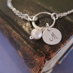 Pearl bridesmaid bracelet with initial Personalized silver | Etsy Silver Initial Pendant Jewelry With Pearl Charm, Silver Jewelry With Pearl Charm Initial Pendant, Silver Pearl Bracelet With Pearl Charm For Mother's Day, Sterling Silver Bracelet For Bridesmaids, Silver Initials Bracelets For Wedding, Silver Initials Bracelet For Wedding, Silver Monogram Jewelry For Wedding, Sterling Silver Pearl Bracelet Gift, Hypoallergenic Silver Bracelet For Bridesmaids