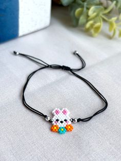 a beaded bracelet with an image of a cat on it