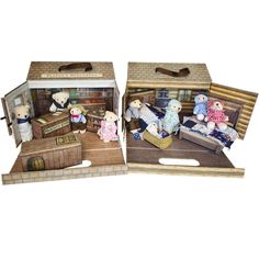 two boxes with stuffed animals in them sitting on the floor