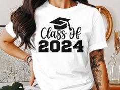 Commemorate the special moment of graduation with our Class of 2024 T-Shirt. This comfortable, unisex tee is the perfect way to celebrate a significant milestone for high school or college seniors. Crafted from soft materials, it's designed to provide a relaxed fit for all-day wear during graduation festivities or as a memorable keepsake. Honor your graduate's achievement with this stylish and timeless graduation apparel. Ideal for grad parties, senior events, or as a gift for a proud 2024 graduate! School Spirit Crew Neck T-shirt For Graduation Party, Casual T-shirt With Text Print For Graduation, Graduation Letter Print Crew Neck T-shirt, Pre-shrunk Short Sleeve T-shirt For Graduation Party, White T-shirt With Letter Print For Graduation, Crew Neck T-shirt With Graphic Print For Graduation Party, School Spirit Short Sleeve T-shirt For Graduation Party, Crew Neck T-shirt For Graduation Party, White T-shirt With Letter Print As Graduation Gift