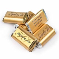 three gold batteries with the words anniversary written on them