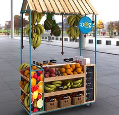 an outdoor fruit stand with bananas, oranges, and other fruits on the display