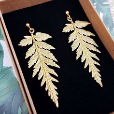 Real fern leaf earrings gold made from brass, Nature-inspired jewelry, Botanical beauty Gifts for Her, Artistic jewelry inspired by plants. Fern leaf earrings made from brass with gold plated 925 sterling silver fasteners without any nickel content, ensuring they are hypoallergenic and safe for sensitive skin. Design based on the pattern of real leaves. The earrings are delicately crafted from jewelry brass showcasing real fern leaves that measure 5 cm in length. You have the option to select from two clasps - a secure pin clasp featuring a ball or English lever-back ear wires with a convenient latch. Rest easy knowing that our earrings are designed with your comfort in mind. The clasp is made of 925 sterling silver covered with gold, completely free from nickel additives, ensuring that ev Leaf Earrings Gold, Fern Necklace, Fern Leaves, Botanical Earrings, Fern Leaf, Skin Design, Real Leaves, Nature Earrings, Gold Leaf Earrings