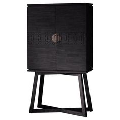 a black cabinet sitting on top of a wooden stand