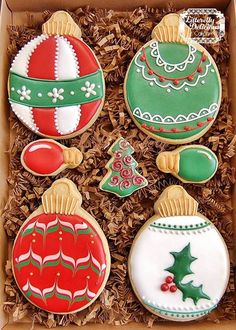 decorated christmas cookies in a cardboard box