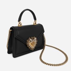 The Devotion Small Bag in Black bag from the D&G line is made of fine calfskin and characterized by the exclusive bejeweled heart closure and strap inspired by the manufacture of fine jewelry. Luxury Handheld Bag With Chain Strap, Classic Bag With Pearl Handle And Rectangular Shape, Classic Rectangular Bag With Pearl Handle, Luxury Evening Bag With Gold-tone Hardware For Gift, Luxury Bag With Chain Strap As Gift, Luxury Bags With Chain Strap As Gift, Luxury Bags With Chain Strap For Gift, Luxury Evening Bag With Detachable Handle For Gifts, Luxury Shoulder Bag With Pearl Handle