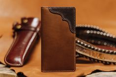 Give a “Cowboy Nod" to the Buck Long Bifold ... Vertically designed for back pocket carry, this Rodeo Wallet delivers function and versatility with generous slots and cash pockets. This long wallet celebrates quality craftsmanship and top-of-the-line leather with careful consideration of all design details. Features: 9 Card Slides, 4 Full Length Bill Compartments To Keep Cash/Receipts, ID Window Olive Canvas Lining Dimensions: 3.5" L x 6.9" H Handcrafted in Full Grain Leather House of Jack Co. G Western Style Brown Trifold Wallet With Card Slots, Western Leather Wallet With Card Slots, Western Leather Wallets With Card Slots, Western Style Leather Rectangular Wallet, Western Style Brown Leather Wallet, Leather Accessories Ideas, Personalized Wallets, Gifts For Anniversary, Leather Anniversary Gift