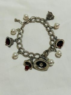 Vintage Avon Silver Tone Bell & Simulated Pearl Charm Chain Bracelet. Beautiful details on the bells with beautiful pearl and red beads. Very beautiful piece in excellent condition would make a wonderful gift to someone special! Thanks for looking.  No refunds or exchanges Vintage Avon Jewelry, Bell Bracelet, Avon Vintage, Vintage Charm Bracelet, Charm Chain, Red Beads, Avon Jewelry, Bracelet Vintage, Pearl Charms