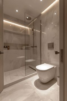 a modern bathroom with marble walls and flooring, including a large tub in the center