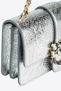 Mini Love Bag One in punched and embossed reptile-print leather. The python-print leather is slightly embossed and the laminated effects and colours provide contrast. The strap fastening is complete with the iconic Love Birds Diamond Cut buckle—in light gold-electroplated metal with black enamel—embellished with pavé-set pearly white stones. Inside, it features contrasting lining, a slip pocket and a zipped divider pocket. The shoulder strap combines the classic round-link chain with a practical Luxury Leather Shoulder Bag With Snake Print, Luxury Snake Print Top Handle Bags, Elegant Leather Bag With Snake Print, Luxury Leather Snake Print Shoulder Bag, Elegant Leather Snake Print Bags, Elegant Snake Print Leather Bags, Luxury Silver Shoulder Bag With Gold-tone Hardware, Luxury Formal Bags With Textured Finish, Luxury Metallic Shoulder Bag With Palladium Hardware