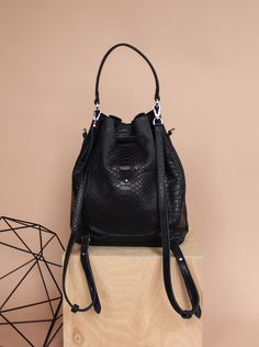 "DESIGN Leather women's bag type sack / backpack 3in1 is the latest proposal from Kulikstyle. Leather bucket bag is not only very \"smart\" but also stylish. A cool every day or night bag, made of 100% italian PREMIUM leather in black color. A comfortable and soft shoulder bag for women with drawstring closure. Can be used as a crossbody bag or a shoulder bag or backpack bag.The perfect chic bucket bag for your every day ! FEATURES - lightweight & soft leather - could be crossbody bag or a s Luxury Large Capacity Bucket Bag For On-the-go, Trendy Leather Travel Bucket Bag, Trendy Leather Bucket Bag For Travel, Leather Bucket Bag With Detachable Handle For Daily Use, Luxury Crossbody Bucket Bag For Everyday Use, Luxury Bucket Bag With Adjustable Strap For Daily Use, Luxury Bucket Bag Backpack For Daily Use, Luxury Bucket Backpack For Everyday Use, Daily Top Handle Bucket Bag With Adjustable Strap