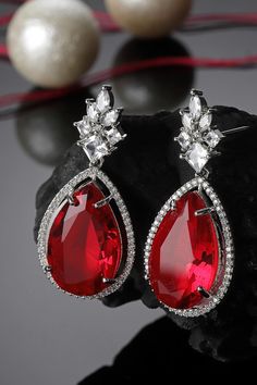 Product Features: Color: Red, Silver Material: Metal Work: American Diamond, Natural Stones Occasion: Festivewear, Partywear, Wedding Guest Product Type: Drop Earring Disclaimer: There will be slight difference in digital to actual image Loom Jewelry, Red And Silver, Red Diamond, Metal Work, Diamond Drops, American Diamond, Drop Earring, Silver Drop Earrings, Metal Earrings