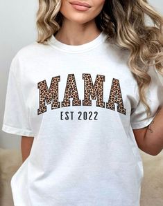 Leopard Print Mama design printed on white Comfort Tee with personalized year. Please contact us for other color or design options. White Sublimation Design T-shirt With Relaxed Fit, Custom Print Sublimation Design In White With Relaxed Fit, Relaxed Fit White Sublimation Design With Custom Print, White Graphic Tee With Letter Print, Casual White T-shirt With Name Print, White Sublimation Graphic Tee With Text Print, White Casual Sublimation Tee With Letter Print, White Graphic Tee With Custom Sublimation Design, Casual White Sublimation Top With Letter Print