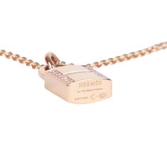 This Necklace is in 18k rose gold and set with 19 diamonds totaling .09 carats. Origin: France Condition: Pristine; new or never worn Accompanied by: Hermes box and dustbag Measurements: Length: 16 in, Pendant 0.72" x 0.5" Luxury Rose Gold Necklaces, Luxury Rose Gold Necklace With Diamond Accents, Luxury Rose Gold Necklaces With Diamond Accents, Luxury Rose Gold Diamond Necklace, Timeless Rose Gold Diamond Necklace For Everyday Luxury, Luxury Pink Gold Diamond Necklace, Rose Gold Diamond Necklace For Everyday Luxury, Luxury Rose Gold Diamond Necklace For Formal Events, Rose Gold Pendant Diamond Necklace With Pavé Setting