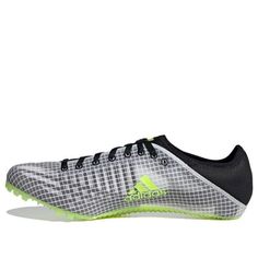 the adidas soccer shoe is shown in grey and neon green colors, with black laces