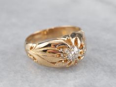 This Victorian solitaire ring has such warmth and charm, that it is difficult to overstate its beauty! From the botanically styled shoulders to the claw prong style Belcher setting, this solitaire ring exudes romance. The centerpiece of this gorgeous mounting is an old mine cut diamond, a gem as special as the ring itself.Metal: 14K Yellow GoldGem: Old Mine Cut Diamond .52 Carats, I in Color, SI1 in ClarityGem Measurements: 5.2 mm, RoundRing Size: 7Marks: "14K" Stamped on the inside band Old Mine Cut Diamond Ring, Victorian Gold Ring, Victorian Diamond Ring, Victorian Ring, Old Mine Cut Diamond, Claw Prong, The Claw, Victorian Gold, Victorian Rings