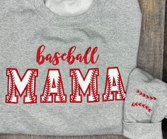 Custom Baseball Mama Embroidered sweatshirt, Baseball Mama Crewneck Sweatshirt, Mama Custom Shirt with Names, Baseball Mama shirt This is the perfect gift for all the  Baseball Mamas who love to show their love for their babies!  FOR EACH SHIRT CHOOSE: Shirt size and color Names on Sleeve (Choose quantity from drop-down menu) Thread Color  Names are placed on sleeve on the right arm when wearing. If you would like on the opposite sleeve, please message us.  ---PRODUCT DETAILS--- Gildan or FOTL C Embroidered Long Sleeve Game Day Sweatshirt, Game Day Cotton Sweatshirt With Custom Embroidery, Game Day Sweatshirt With Embroidered Text, Game Day Long Sleeve Sweatshirt With Embroidered Text, Game Day Embroidered Crew Neck Sweatshirt, Game Day Embroidered Crew Neck Top, Varsity Cotton Tops With Custom Embroidery, Sporty Long Sleeve T-shirt With Letter Embroidery, Cotton Varsity Top With Custom Embroidery