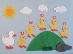 a felt board with ducks and numbers on it