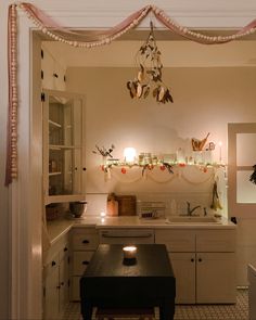 the kitchen is decorated with lights and decorations