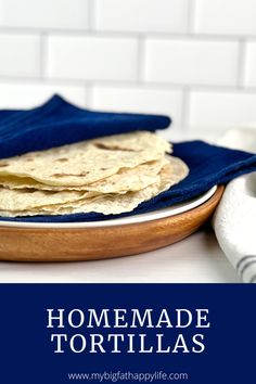 homemade tortillas on a plate with blue cloth