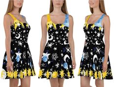 a woman wearing a dress with stars and planets on it