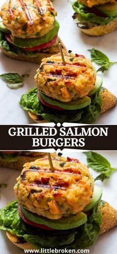 grilled salmon burgers with lettuce, tomato and cucumber on them