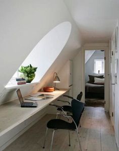 an attic converted into a bedroom and office