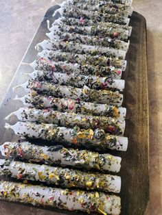 a long tray filled with lots of different kinds of food on top of a table