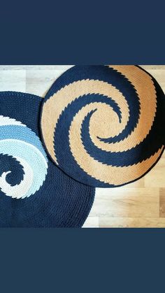 two round rugs sitting on top of a wooden floor