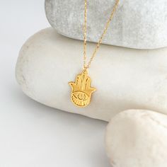 "The sunray style hamsa necklace is a stylish, eye-catching and meaningful piece of jewelry. This necklace makes an elegant gift for yourself or someone special. PRODUCT DETAILS * Material: 14K Solid Gold (real solid gold, no gold-filled or no gold plated material) * Choice of Gold Color: Yellow Gold, Rose Gold, White Gold * Necklace Length: 16 inch * Closure: Spring ring * Chain style: Cable * Adjustable Length Thinking of gifting? Elevate your order with our Christmas Gift Wrap option! 🎁 Buy from here! https://www.etsy.com/listing/1580219719/ M O R E F R O M U S Mionza Jewels' pieces are handcrafted by 30 years of experienced craftsmen and made to order. I only work with high-quality, enduring materials, precious metals, set with genuine gemstones and ethically sourced diamonds. I have Gold Evil Eye Symbolic Necklace, Traditional Gold Evil Eye Necklace, Hand Of Hamsa, Blue Hamsa, Hamsa Necklace Gold, Hamsa Evil Eye, Good Luck Necklace, Hand Pendant, Gold Hamsa